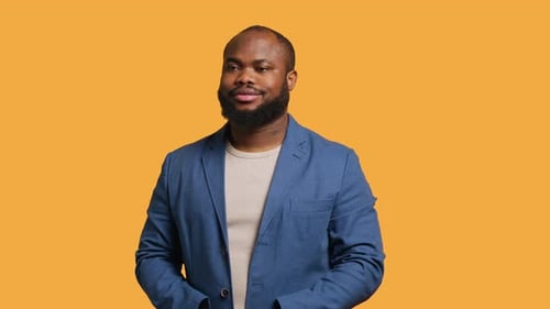 Portrait of Cheerful Man Smiling Looking Pleased Studio Background