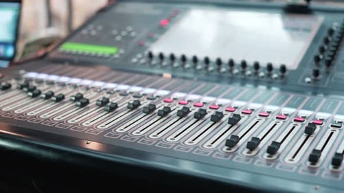 Sound Director Working on Audio Mixer in Professional Studio. Sharp Near Of