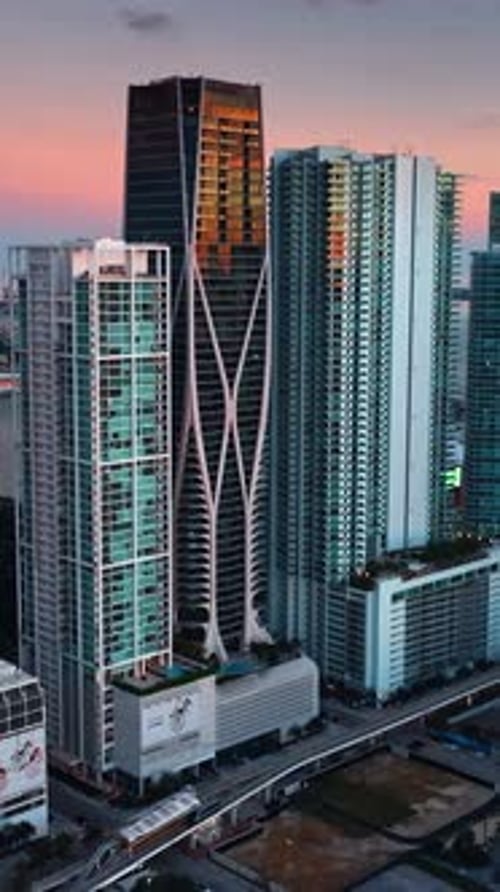 Approaching the group of skyscrapers standing close to each other.
