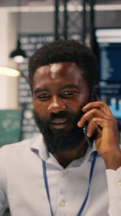 Vertical Video Black Male Professional Engaged in Voice Communication Via Mobile Call
