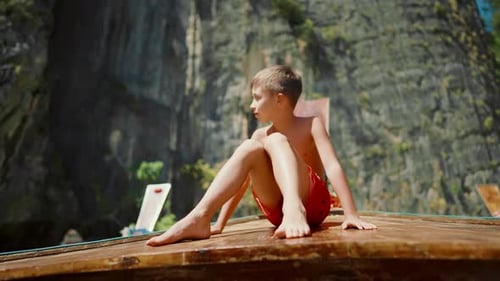 Happy Caucasian Child Traveling to Thailand Little Boy Sitting on Longtail Boat Carefree Childhood