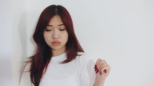 Young Woman Posing in White Shirt in Studio