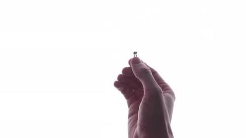 Hand Putting Ring On Girlfriend's Finger During Romantic Marriage Proposal In White Background. - cl