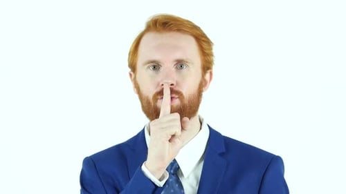 Gesture of Silence Rote Haare Bart Geschäftsmann Finger auf den Lippen