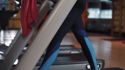 Attractive Young Woman on Treadmill Use Phone in Gym Sunlight Sportsman Sport Fitness Internet Face