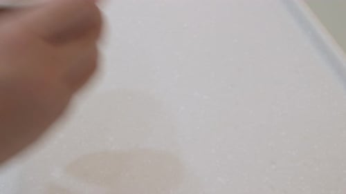 Hand Picks Up Tasty Coffee with Latte Art