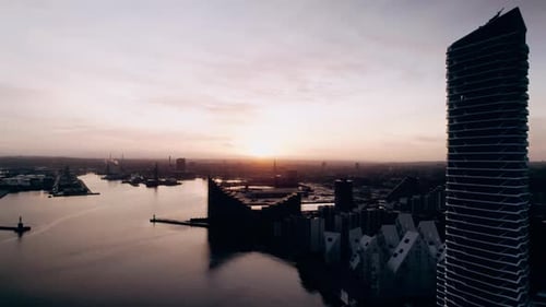Drone Flight Over Harbor Cityscape At Dusk