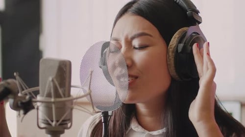 Professional Singer Records in the Studio with a Dynamic Performance