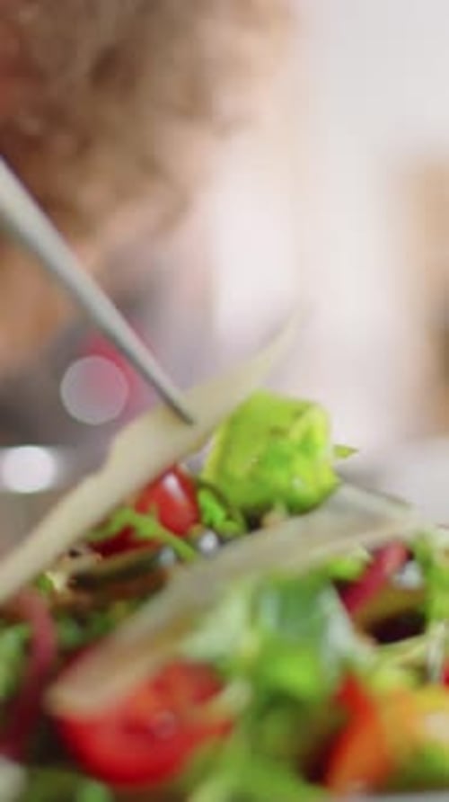 Close-up of Excited Man Watching Chef Finishing Up Salad During Master Class