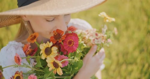 CloseUp of Face of Woman Holding Bouquet of Colorful Flowers