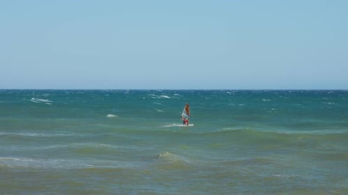 Wind surfer passing by in slow motion