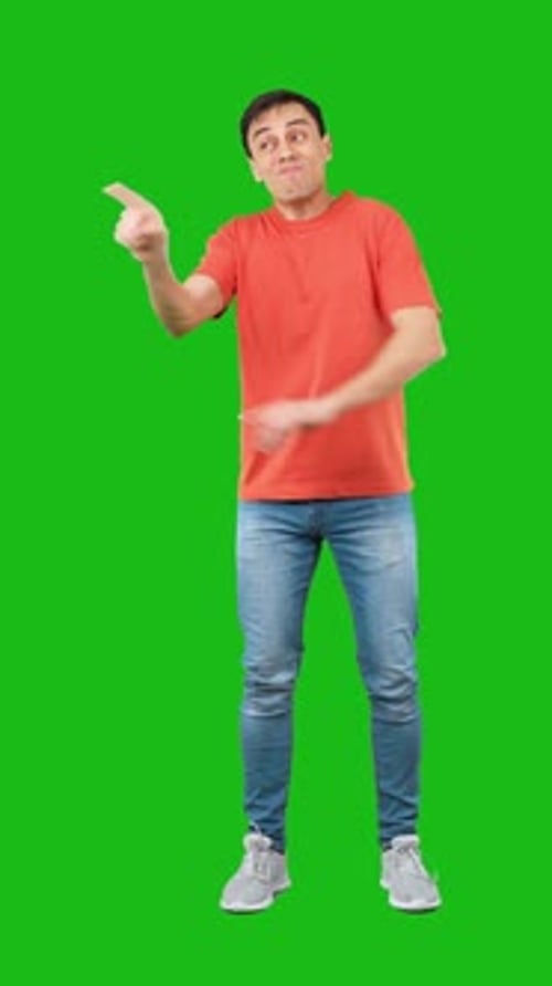 Man Gesturing in Front of a Green Screen
