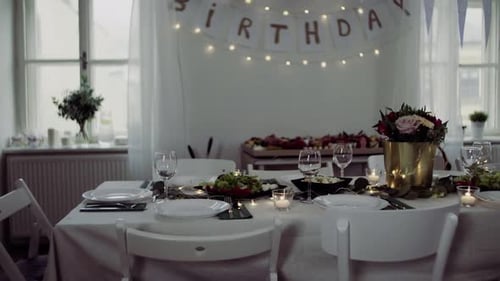Celebratory Birthday table with food and decorations inside