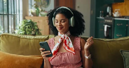 Music, dance and woman with phone on sofa for streaming video, subscription and multimedia