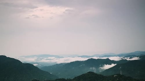 Tranquil mountains shrouded in mist.