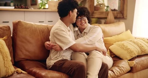 Home, couch and couple with hug for love, connection and bonding together with affection in lounge