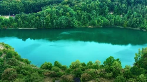 Beautiful aerial view of a small lake and water reflection.
