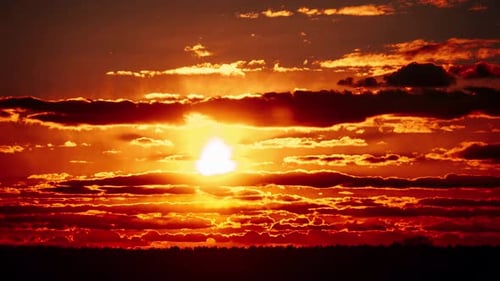 Vibrant Orange Sunset Timelapse with Dramatic Cloudscape