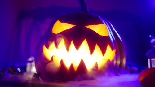 A Terrible Pumpkin Lantern with Carved Eyes and an Evil Grin That Emits Smoke