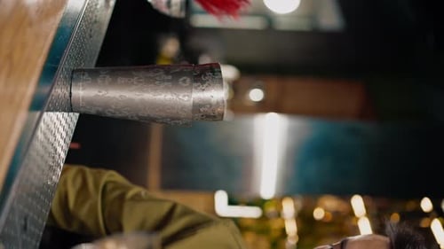 Bartender Preparing a Drink with Ice and Shaker