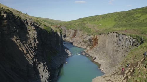 Stuðlagil Canyon With Unique Volcanic Basalt Column Formation In Iceland - aerial pullback