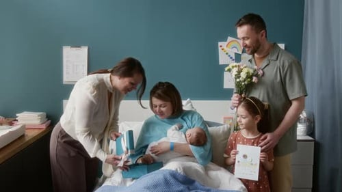 Family Visiting Woman and Baby in Maternity Hospital