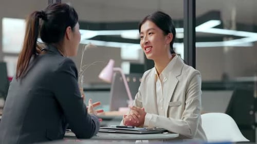 Cheerful girl passed successfully job interview shake hands female HR finish meeting company office
