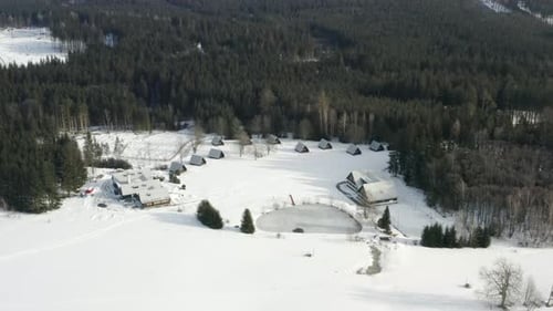 Aerial Shot Of Winter Ski Camp In A Alpine Mountain Landscape During Winter, Snow Covered