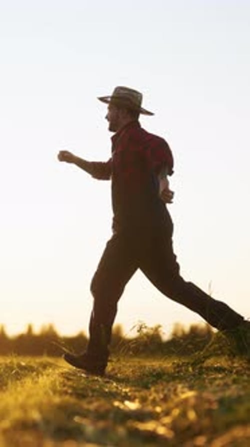Joyful Carefree Villager Running and Jumping in Beautiful Agricultural Field in Summer Feel