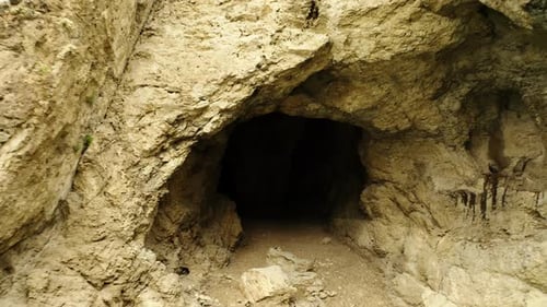 Enigmatic Cave Interior Inside View of a Dark and Enigmatic Cave with Rocky Surfaces and Visible