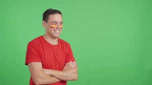 Man Laughing in Front of a Green Screen