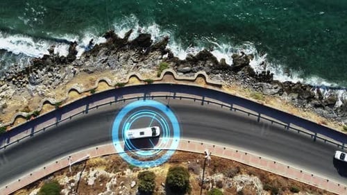 Vehicles drive on the road along the seashore, artificial intelligence controls the vehicles traffic