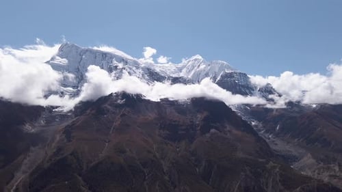 panoramic view of annapurna peak covered in snow with blue clear sky nepal