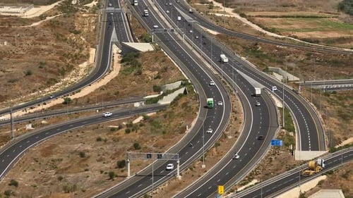 Highway traffic on multiple highways roads with traffic on all roads, Aerial footage