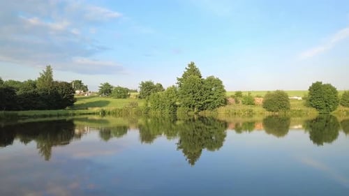 Beautiful spring landscape with small pond.