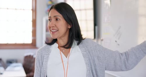 Woman Explains Content at Whiteboard