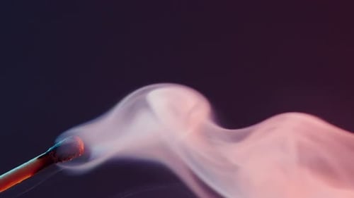 Burning Match Emitting Colorful Smoke