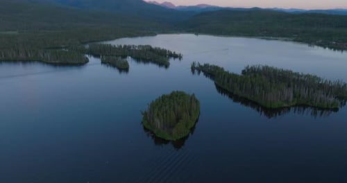 Tilting Drone shot of Shadow Mountain Lake at sunset in Colorado