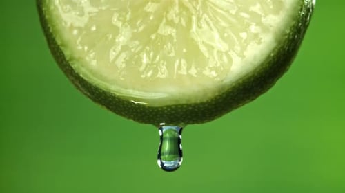 A Drop Falls From Half a Lime Filmed on a Highspeed Camera at 1000 Fps