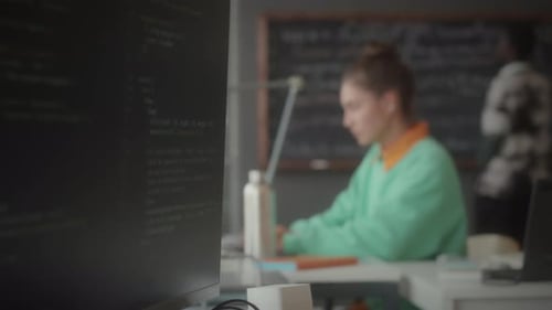 Young Man and Woman Working in Office of IT Company