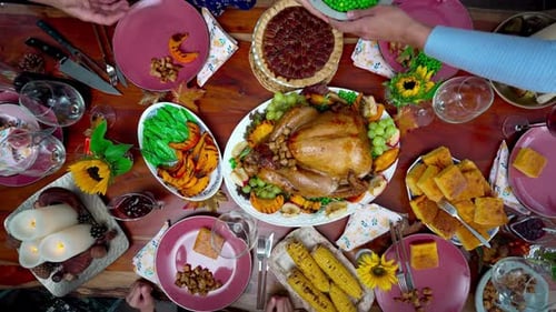 Overhead View of Thanksgiving Dinner with Family and Friends