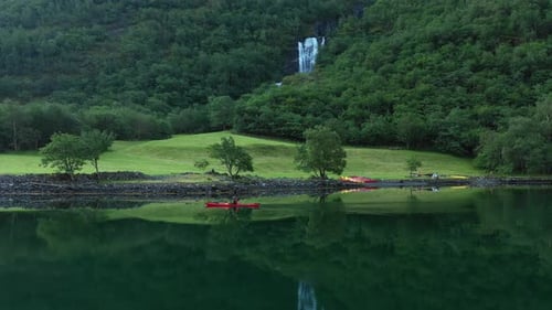 kayaker kayaking on a calm morning in Norway