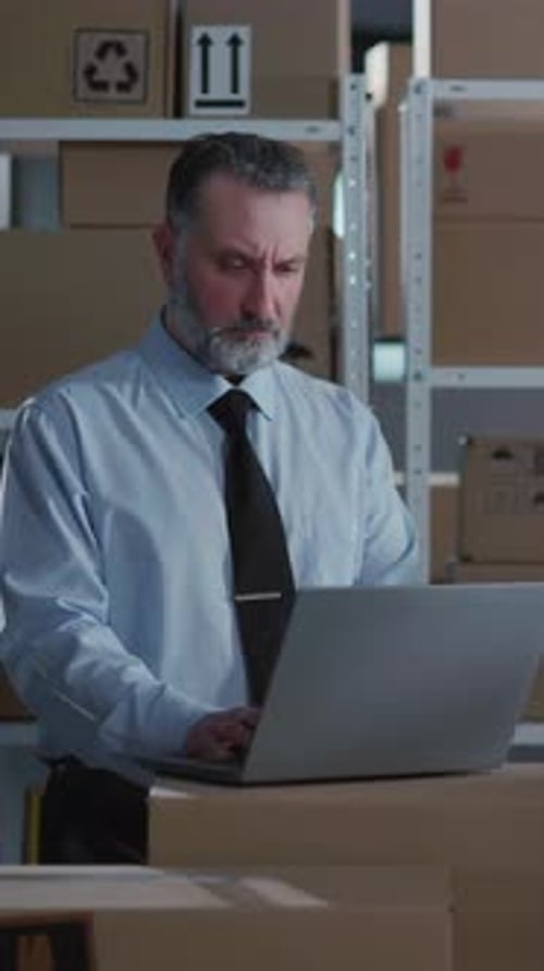 Couple of Cooperative Males Working in Post Office Storage Young Worker Carrying Heavy Carton Boxes