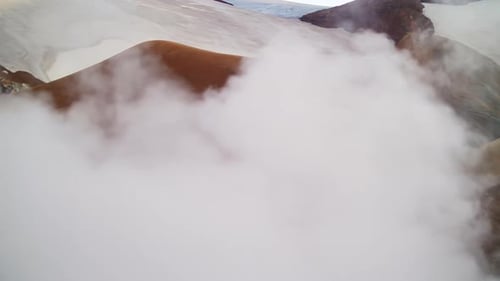Thick Geothermal Steam Covering Volcanic Mountains in Iceland