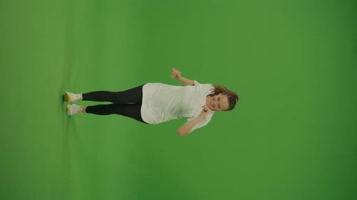Vertical Video Female Dancer Performing a Dance on Green Screen Street Dancing