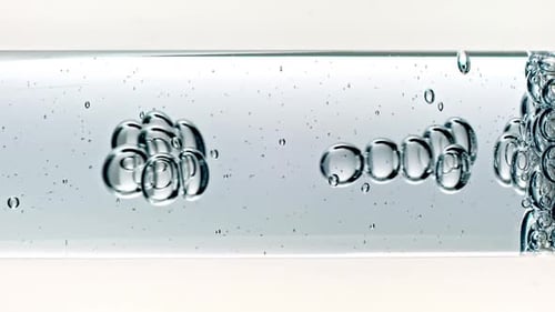 Air Bubbles Floating Horizontally in Water