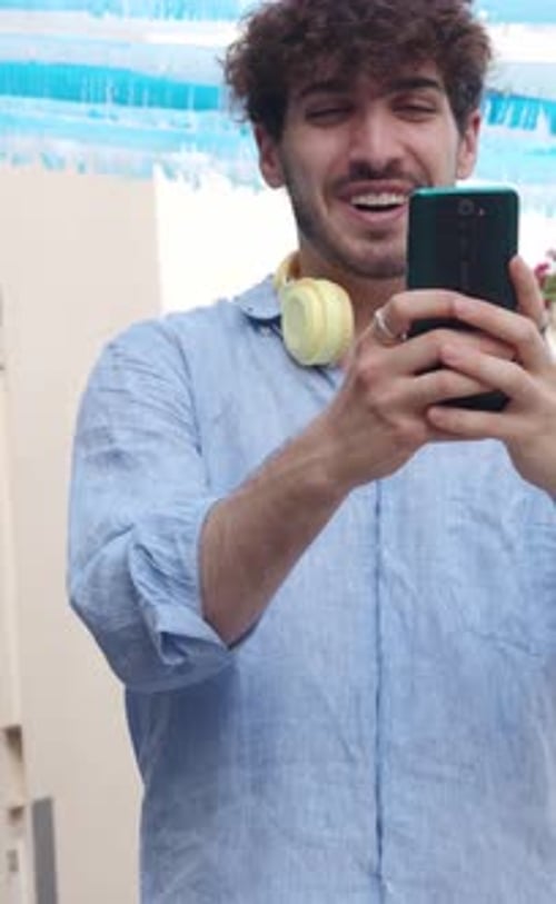 Young Man Using Smartphone for Video Call
