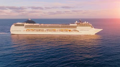 Cruise ship explores the vast ocean with stunning sunset views