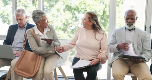 People Wait in Office Interview Room