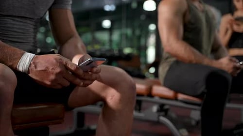 Member in Fitness gym using smartphone technology planing workout, Healthy Lifestyle bodybuildin